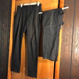 Two pack of H&M black chinos style pants. One 34R and one 33R. signs of wear.